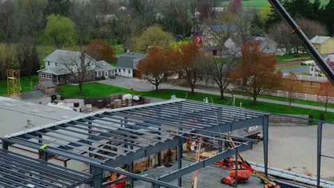 Workers are on site as they build a new structure in a residential area Video stock 329152698
