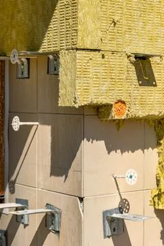 Workers are using insulation and tiles for a construction project at a buil.. Stock Photos