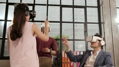 Workers are using VR headsets to visualization cyberspace at business office. Stock Footage 169000049