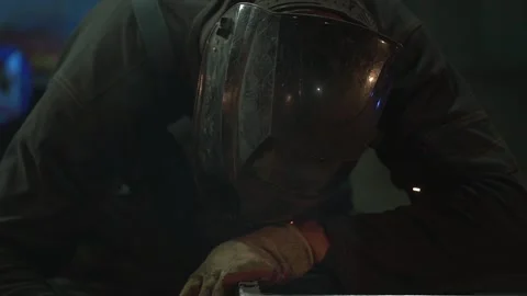 Workers are Welding in Protective Helmets and Glasses Stock Footage 128805202