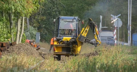 Workers Are Working Digging Yellow Excavator is Digging Moving Building at the Stock Footage 55113630