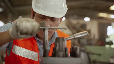 Workers are working with machines inside the factory. Stock Footage 147060179