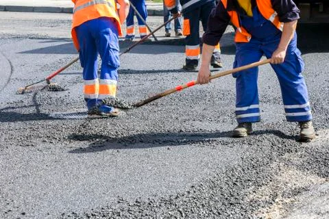 Workers on Asphalting road Foto stock
