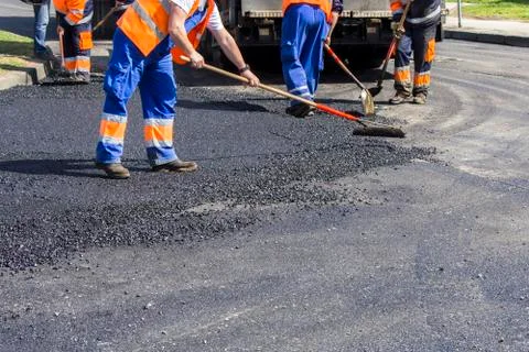 Workers on Asphalting road Stock Photos