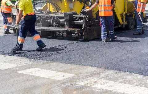 Workers on Asphalting Road Stock Photos