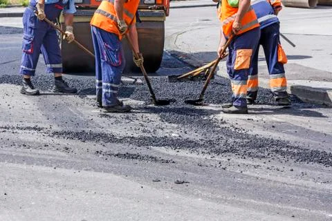 Workers on Asphalting Road Stock Photos