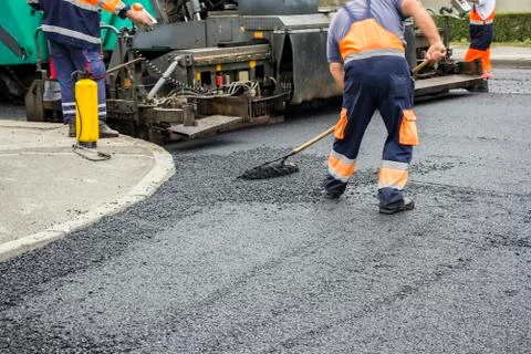 Workers on Asphalting road Stock Photos