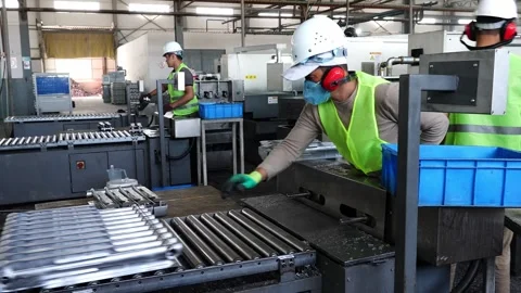 Workers assemble battery parts. Stock Footage 310740495