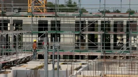 Workers assemble a concrete slab on the construction of a house Stock Footage 40828223