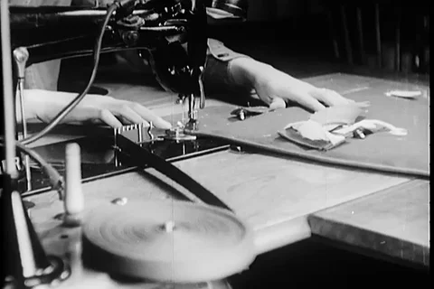 Workers assemble the flak suit and inspected by factory inspector - 1945 Stock Footage 99786843