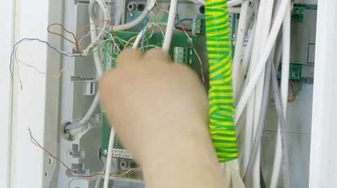 Workers assemble the wires in voltage connector. Time lapse. Stock Footage 43749140