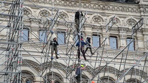 Workers assembles temporary building Stock Footage 192328079