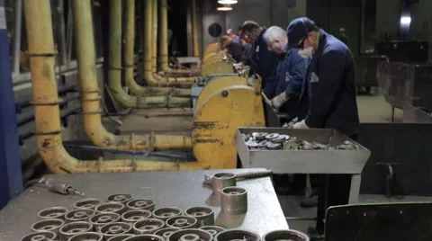 Workers  the assembly workshop make metal parts for pumps Stock Footage 62085415