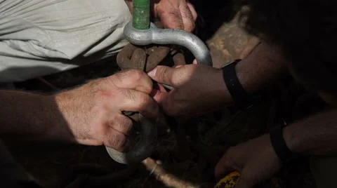 Workers attach the hook of a crane. Detail. Stock Footage 65885580