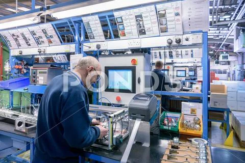 Workers On Automotive Parts Production Line In Automotive Parts Factory