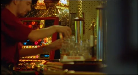 Workers at bar cleaning after customers have left for football match, UK 90's Stock Footage 159443312