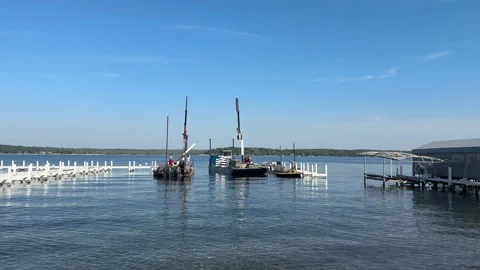 Workers On Barges Removing Docks From Waters Of Geneva Lake In Wisconsin, USA Stock Footage 319475501