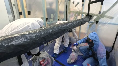 Workers being trained in asbestos removal and safety processes Stock Footage 185413181