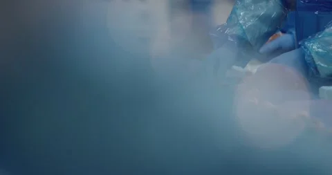 Workers in blue protective gear placing meat rolls on conveyor, Static Shot Видео 340016368