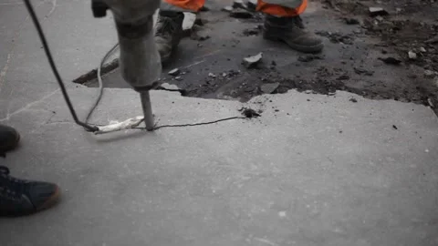 Workers break the asphalt with a jackhammer. Stock Footage 136166910