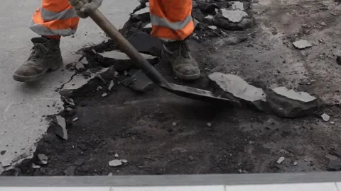 Workers break the asphalt with a jackhammer. Stock Footage 136166923