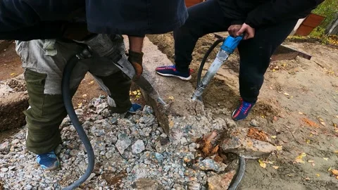 Workers break concrete with pneumatic jackhammers Stock Footage 195980163