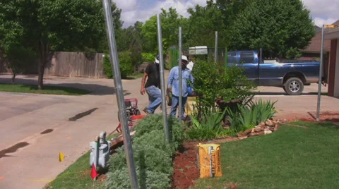 Workers build fence 2 Stock Footage 30332444
