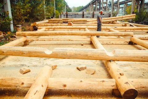 Workers build a house of logs Stock Photos