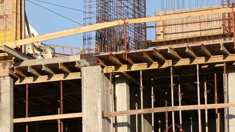 Workers Build industrial building on construction site Stock Footage 81485504