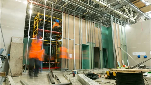 Workers build inner walls with drywall sheets timelapse Stock Footage 94469123