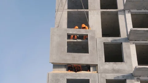 Workers build multi-storey building installing wall panels Stock-Footage 124299266