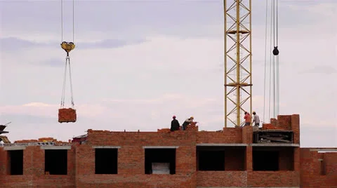 Workers build a skycraper by a crane time lapse Stock Footage 25059022