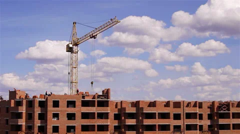 Workers build a skycraper by a crane time lapse Stock-Footage 25059288