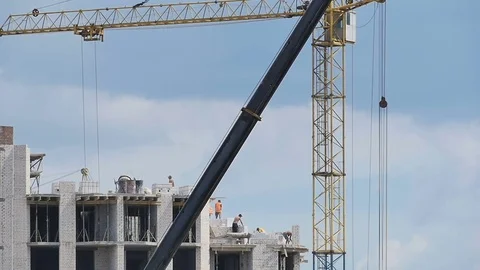Workers building a building Stock Footage 77076375