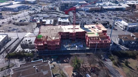 Workers Building A Condominium Building On A Construction Site With A Crane In 스톡 동영상 332628774