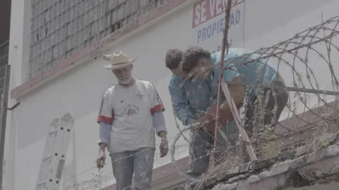 Workers at a building in San José, Costa Rica Stock Footage 344342414