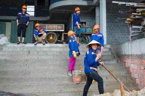 Workers at building site with blue work outfit Stock Photos