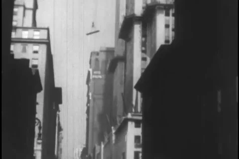 Workers carry huge structural beam during building construction - 1930 Stock Footage 104336496