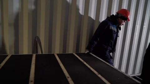 Workers carry a large stove. Stock Footage 105228370