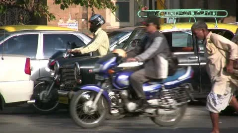 Workers carrying cart with heavy boxes through traffic in Mumbai Stock-Footage 11018425