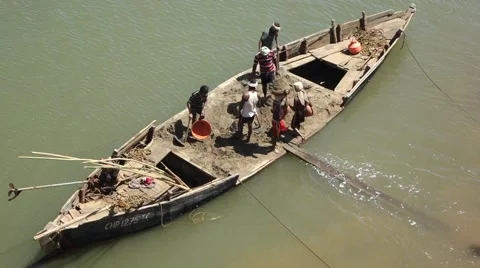 Workers carrying mud from cargo ship at Terekhol river Stock-Footage 43855434