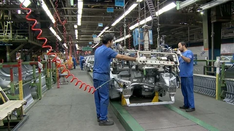Workers at cars' assembly line inside Khodro car factory, Tehran, Iran Stock Footage 119179673