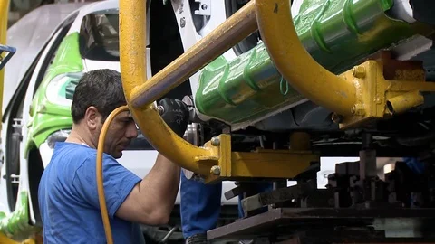 Workers at cars' assembly line inside Khodro car factory, Tehran, Iran Stock Footage 119182146