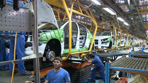 Workers at cars' assembly line inside Khodro car factory, Tehran, Iran Stock Footage 119183164