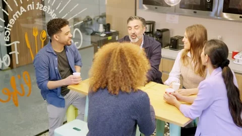 Workers chatting during coffee break in a coworking Stock Footage 270411433