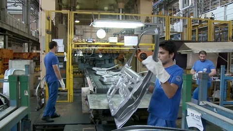 Workers check and collect auto parts inside Khodro car factory, Tehran, Iran Stock Footage 119159797