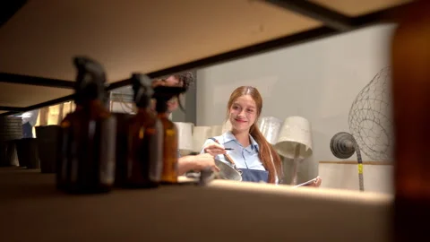 Workers checking inventory in a warehouse using a tablet for efficient stock Stock Footage 339643060