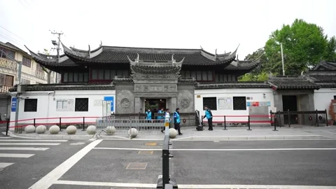 Workers checking panels before opening the Yuyuan Garden in the morning Stock Footage 318654339