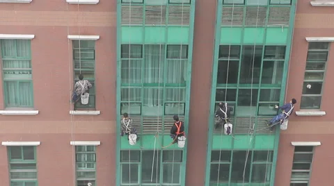 Workers clean an apartment block in downtown Beijing Stock Footage 42860267