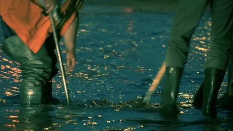 Workers clean the storm sewer to drain large amounts of water after city flood Stock Footage 78072321
